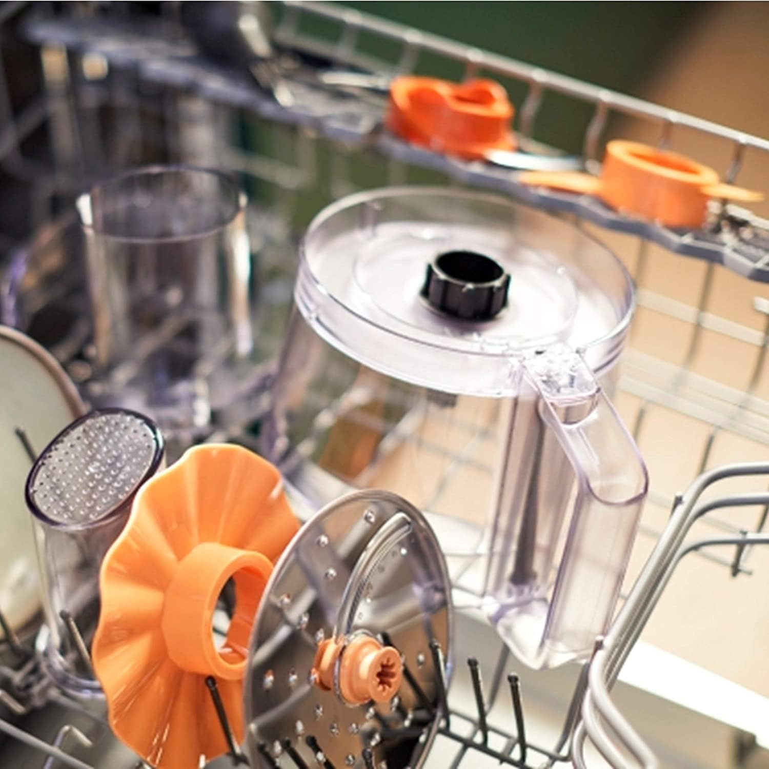 Various parts of the food processor in a dishwasher rack