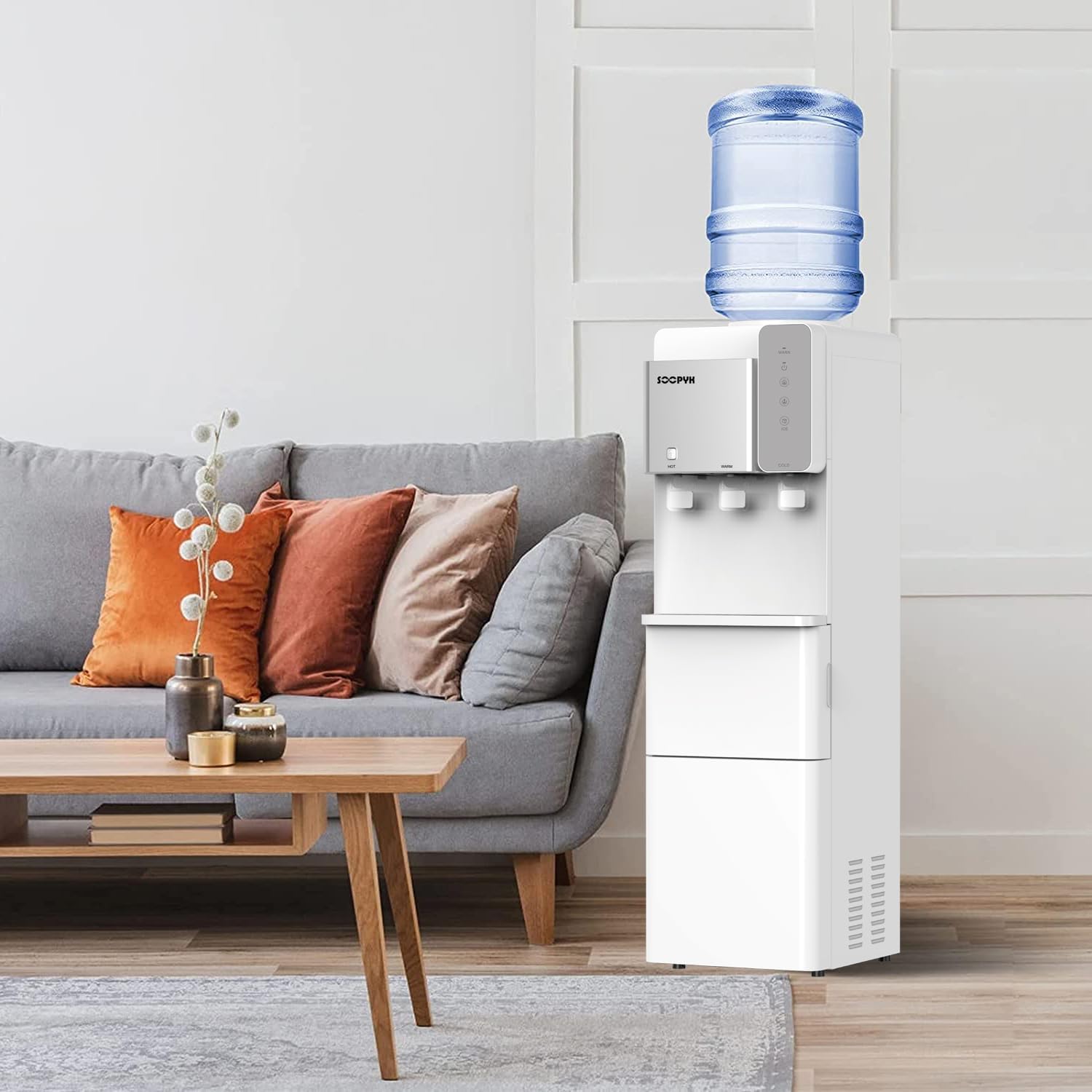 A person placing a 5-gallon water bottle onto the top loading water dispenser.