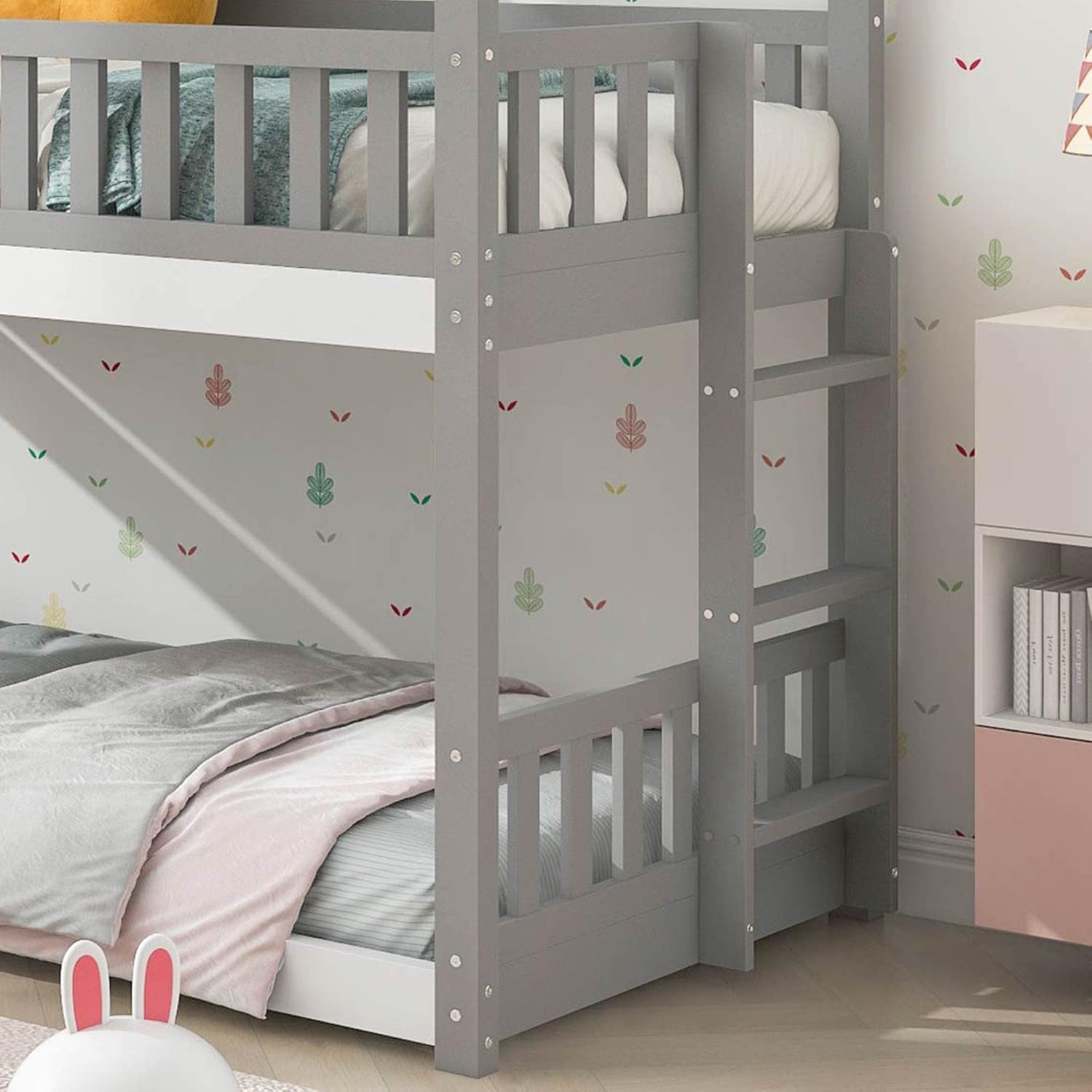 Close-up view of the ModernLuxe bunk bed ladder and lower bunk, highlighting the safety rails and sturdy construction.