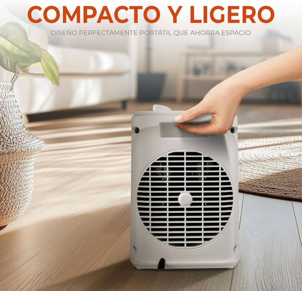 Mainstays heater being carried, highlighting its compact and lightweight design