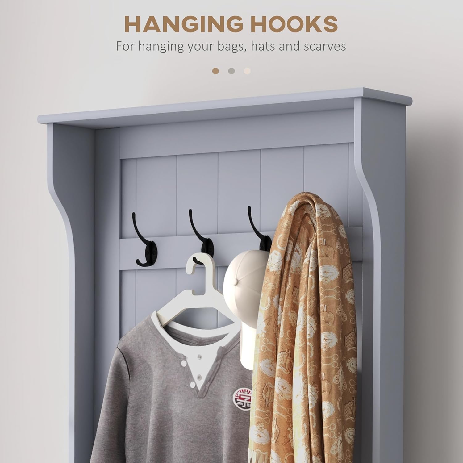 Close-up view of the four black metal hooks on the HOMCOM Hall Tree, with a coat and scarf hanging.