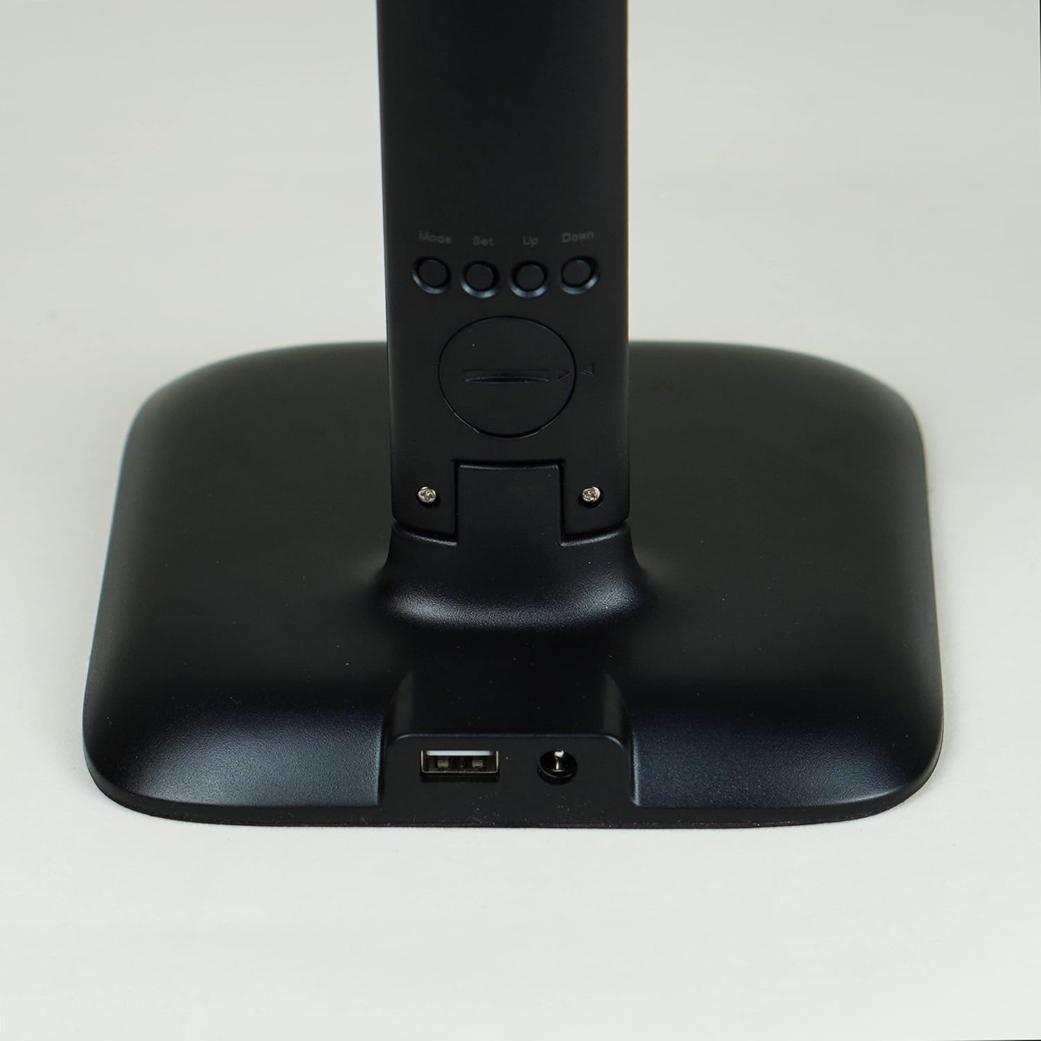 Close-up of the INSPIRE ALEX Desk Lamp's base, showing the USB charging port and the DC power input.