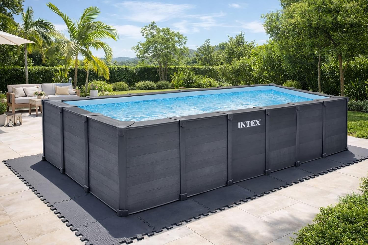 Intex 26398GS Rectangular Graphite Frame Pool set up in a garden