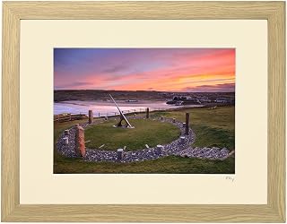 Mounted or framed photograph by Andrew Ray featuring the sundial at Perranporth in Cornwall at sunrise.