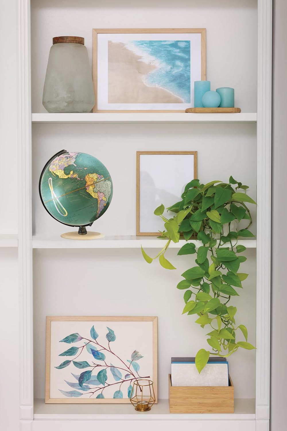 Nelson 9" Diameter Globe, USA Cartography with Mountain Relief, Solid Hard Wood Base and Teal Ocean Globe Ball. Standing 12” tall the Nelson Designer Globe matches the unique, rich, teal ocean coloring with the colorful country markings of the globe. Rich with content featuring over 1500 place names but still elegantly designed with the perfect combination of colors. This 9″ diameter globe is held by a black die-cast numbered meridian and a natural unfinished base. This environmentally conscience globe is made of reclaimed paper fiber and uses no lacquer or chemicals on the natural hard wood base.