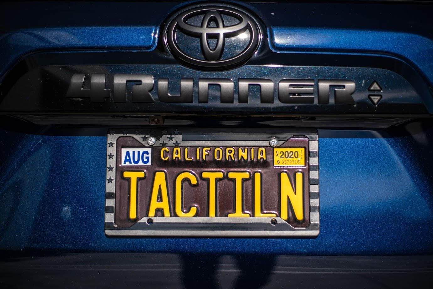TACTILIAN American Flag License Plate Frame - Subdued 3D Embossed USA Flag in Black Gloss on Matte Finish for Car, Truck or SUV (Gloss on Matte Black)
