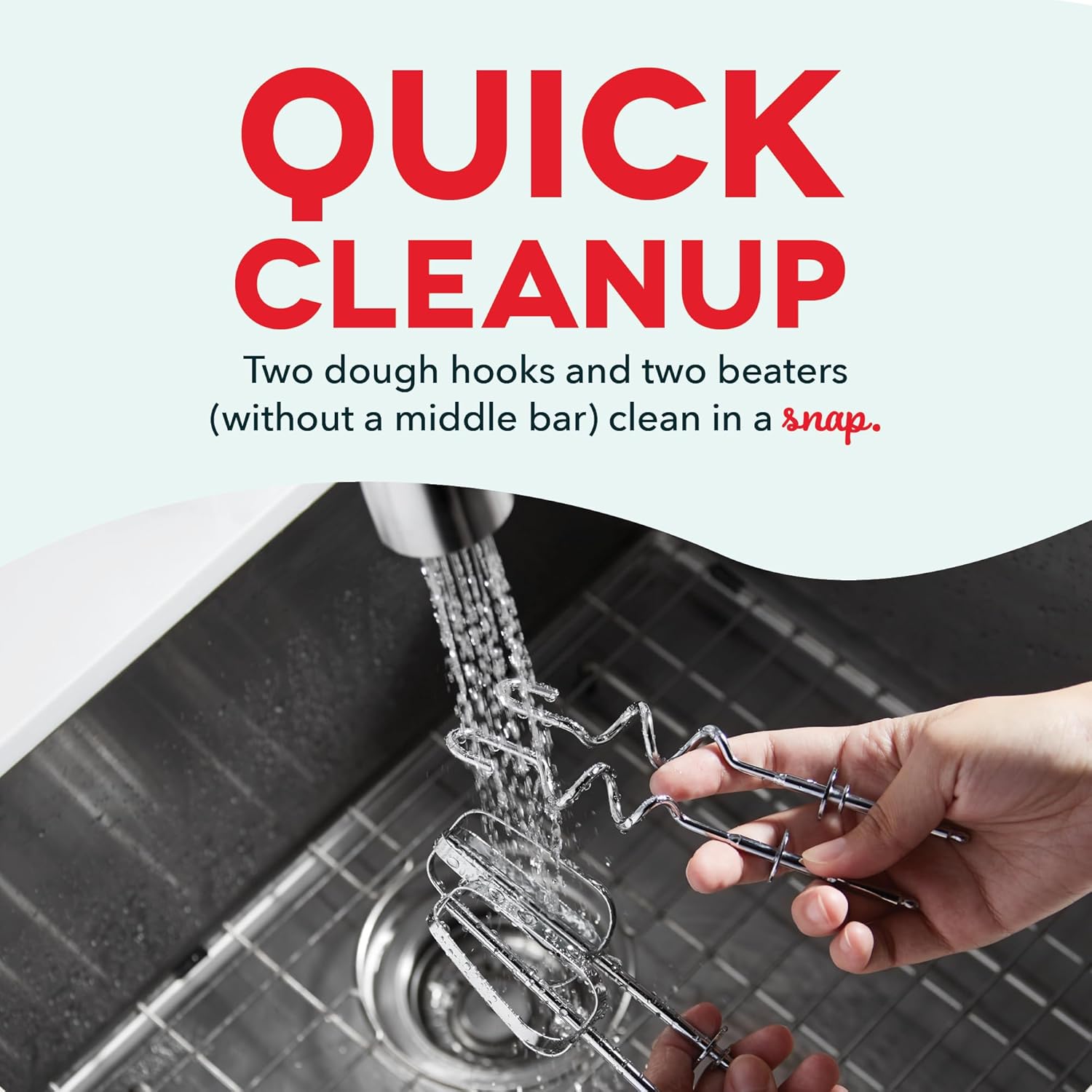 Hands washing mixer beaters and the mixing bowl in soapy water, demonstrating quick cleanup.