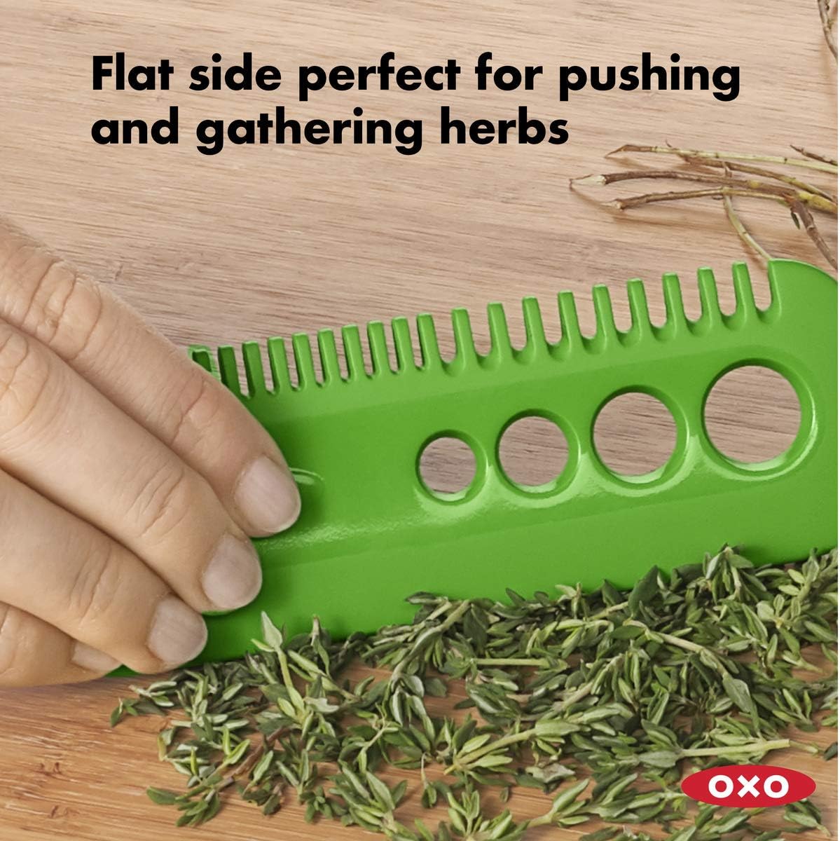 Image highlighting the flat side of the OXO herb stripper, ideal for pushing and gathering herbs