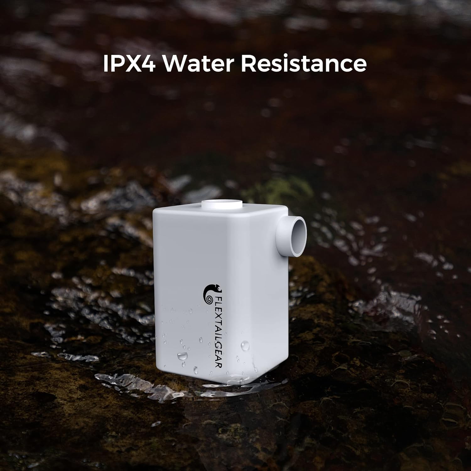 FLEXTAILGEAR Portable Air Pump shown near water, emphasizing its IPX4 water resistance.