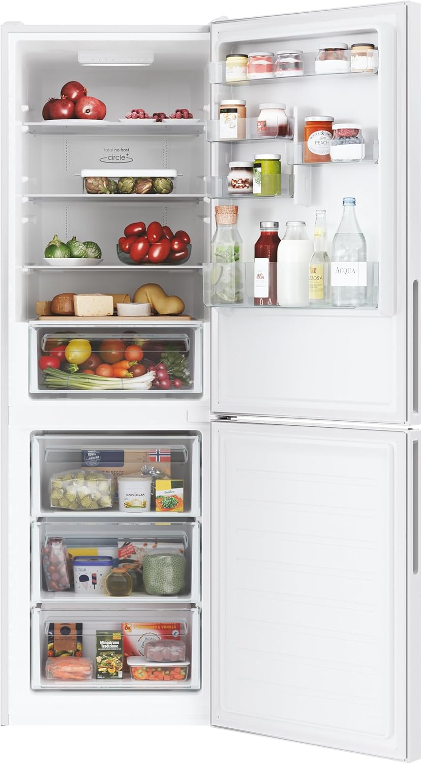Interior view of the Candy Fresco CCE4T618EW refrigerator with food items