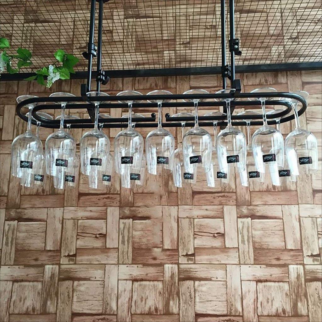 Estante para vinos de restaurante y mostrador que organiza copas inversas en barras retro