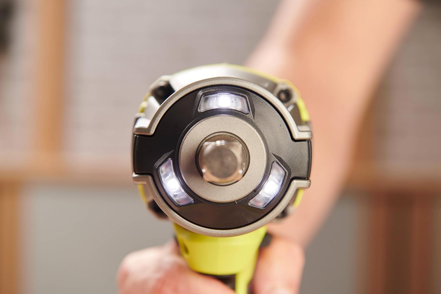 Close-up of Ryobi RIW18BL-0 impact wrench head with Tri-Beam LED lights illuminated