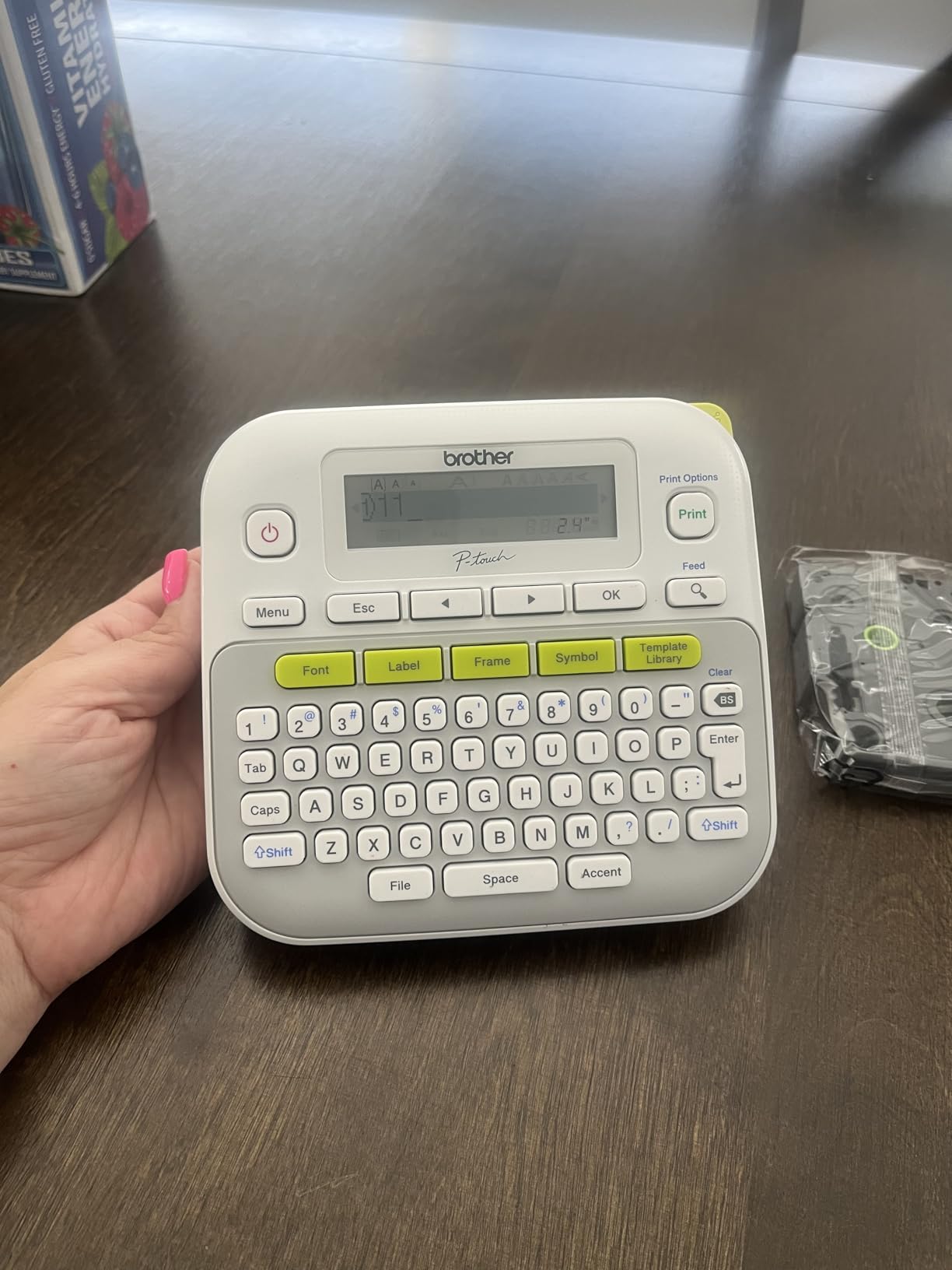 Classroom bins and folders labeled with a label maker