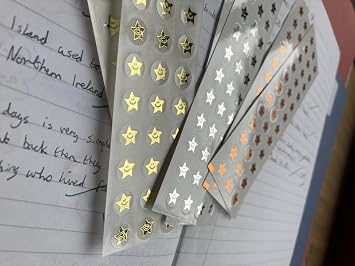 Mini reward smiley star stickers in gold, silver and bronze. 540 x 10mm stickers per pack. 180 of each colour.