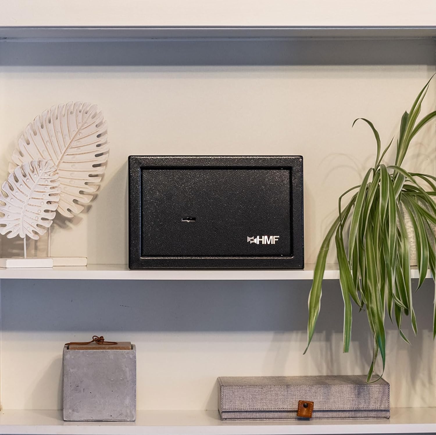 The HMF 49200-02 safe discreetly placed on a shelf, demonstrating its compact size and suitability for various environments.