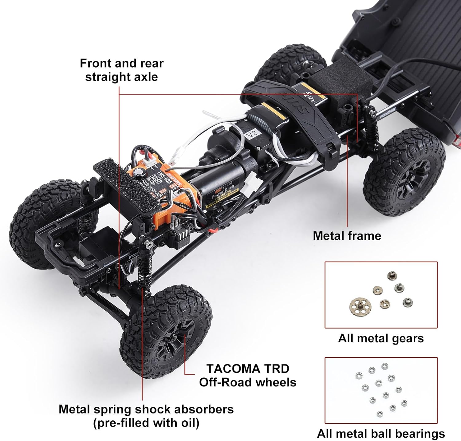 Underside view of the FMS FCX24 RC crawler chassis, highlighting the metal frame, metal spring shock absorbers, and all-metal gears and ball bearings.