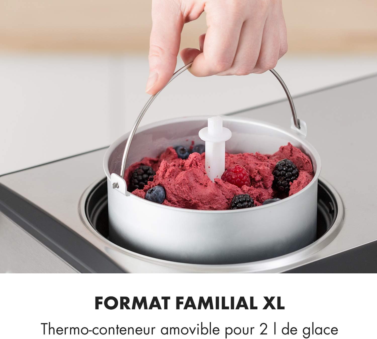 Hand lifting the removable ice cream container from the Klarstein Dolce Bacio Ice Cream Maker