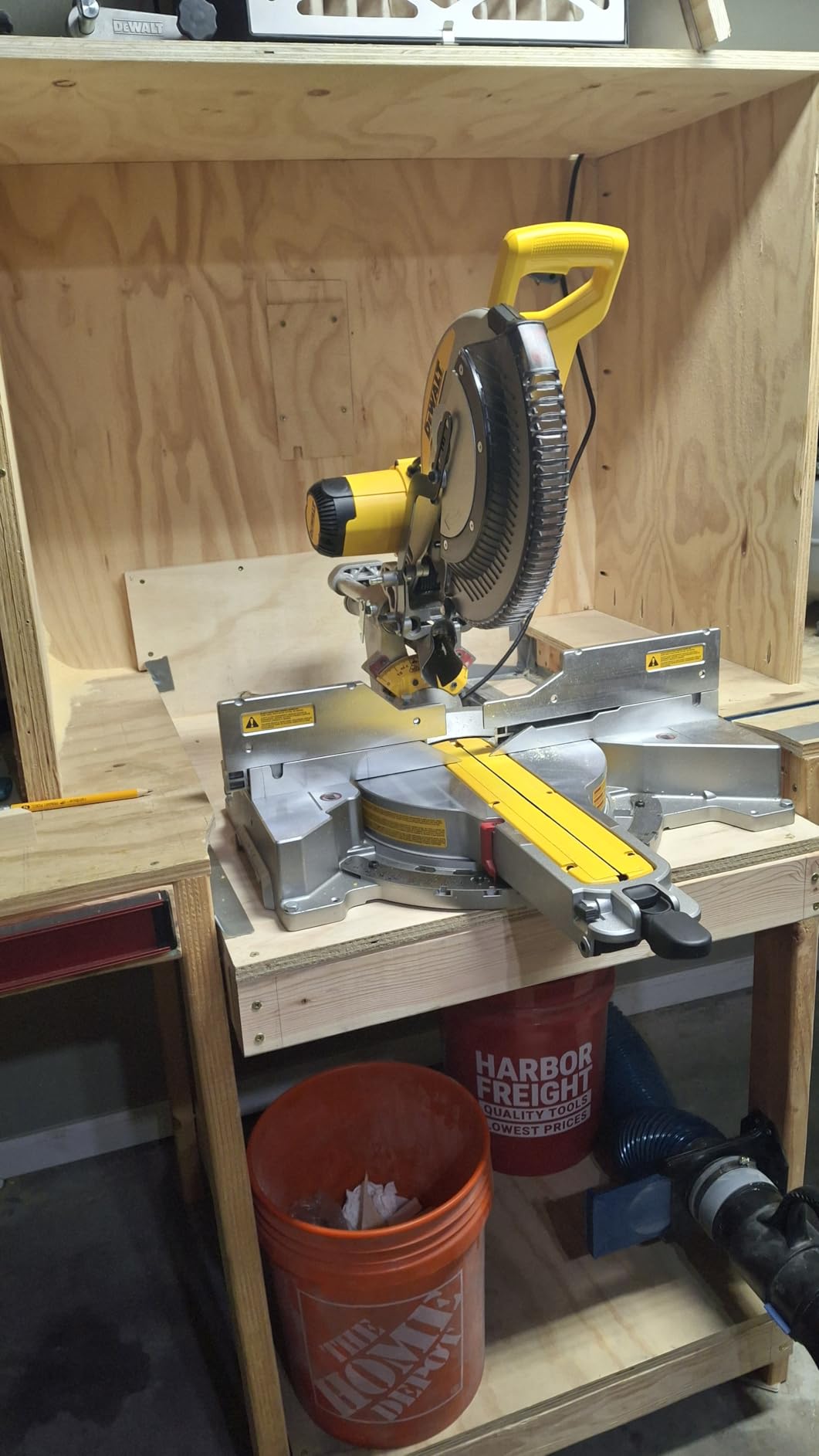 Compound miter saw cutting a wooden board at an angle