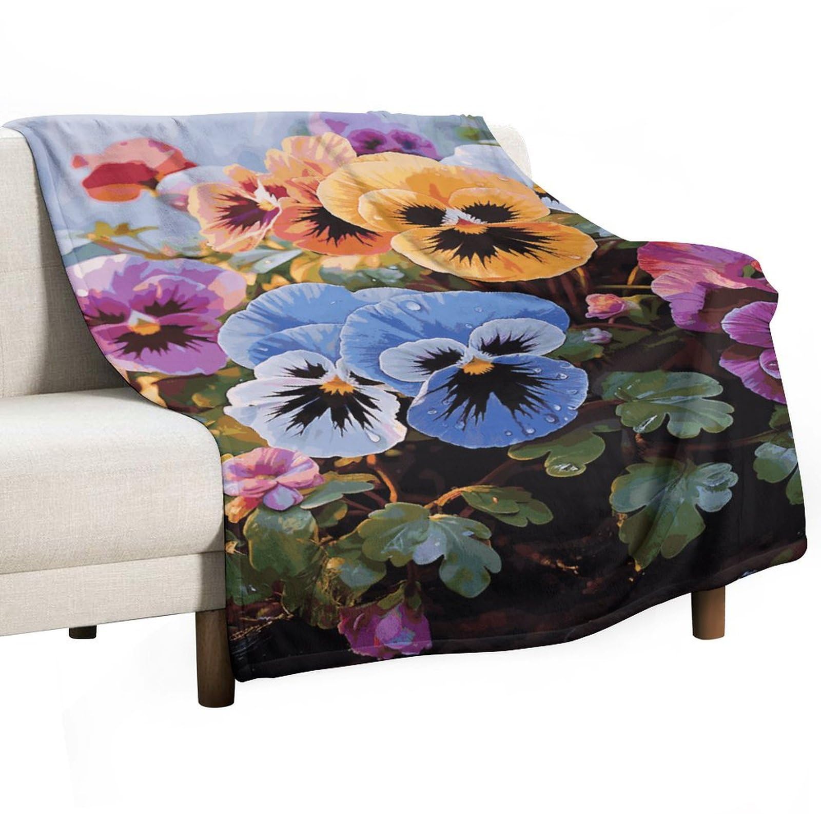 Couverture polaire fleurs de pensées pour cocooning sur le canapé