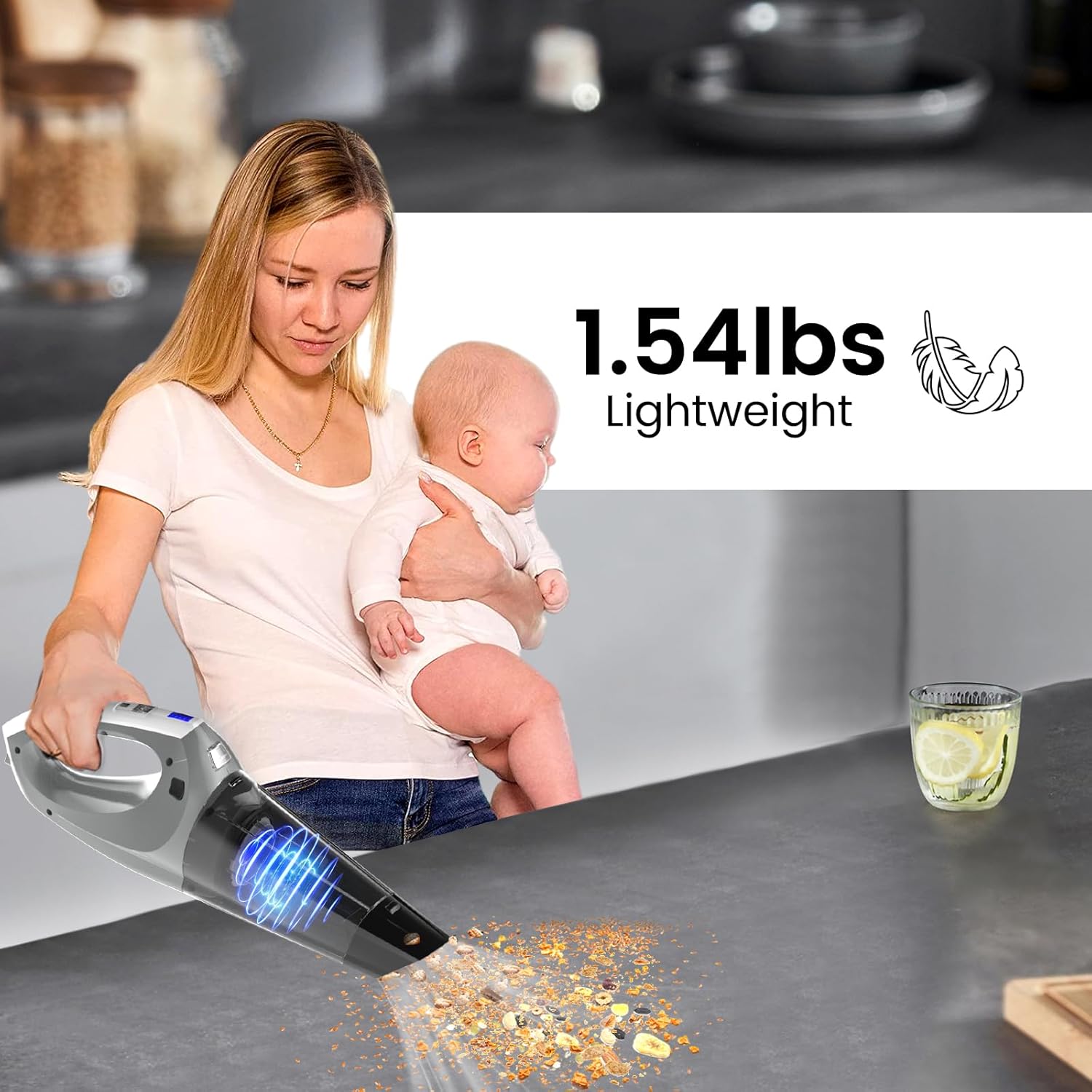 Person holding Hihhy H-508 vacuum while holding a baby, emphasizing its lightweight design