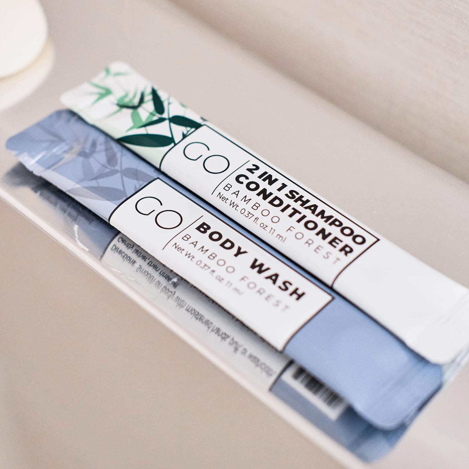 Go Essentials - Bundle Sets (Bamboo Forest and Refreshing Mint, 80 Packets Total (20 of Each)) Travel size mouthwash, shampoo/conditioner, body wash, body lotion.