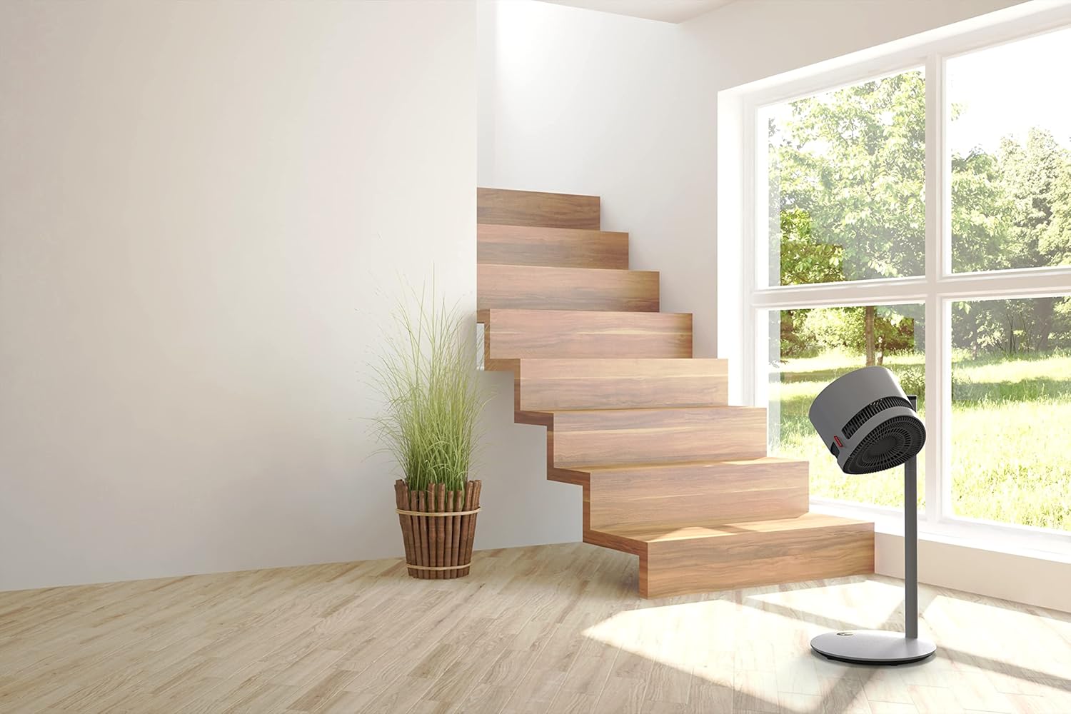 BONECO F225 Pedestal Fan placed in a modern living room with a large window and wooden stairs, demonstrating its aesthetic integration and potential for air circulation.