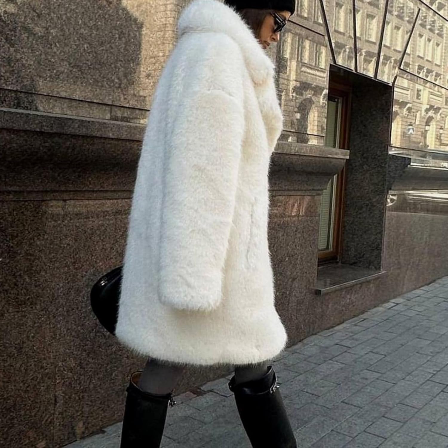 Fashionable women's mid-length faux fur coat with blazer collar and plush faux fur exterior