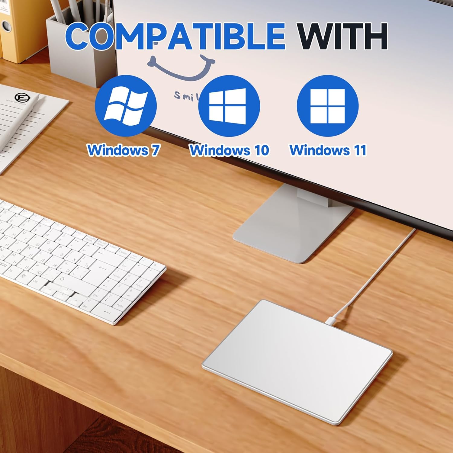 Homiguar Wired Trackpad on a desk with a monitor, showing compatibility logos for Windows 7, Windows 10, and Windows 11.