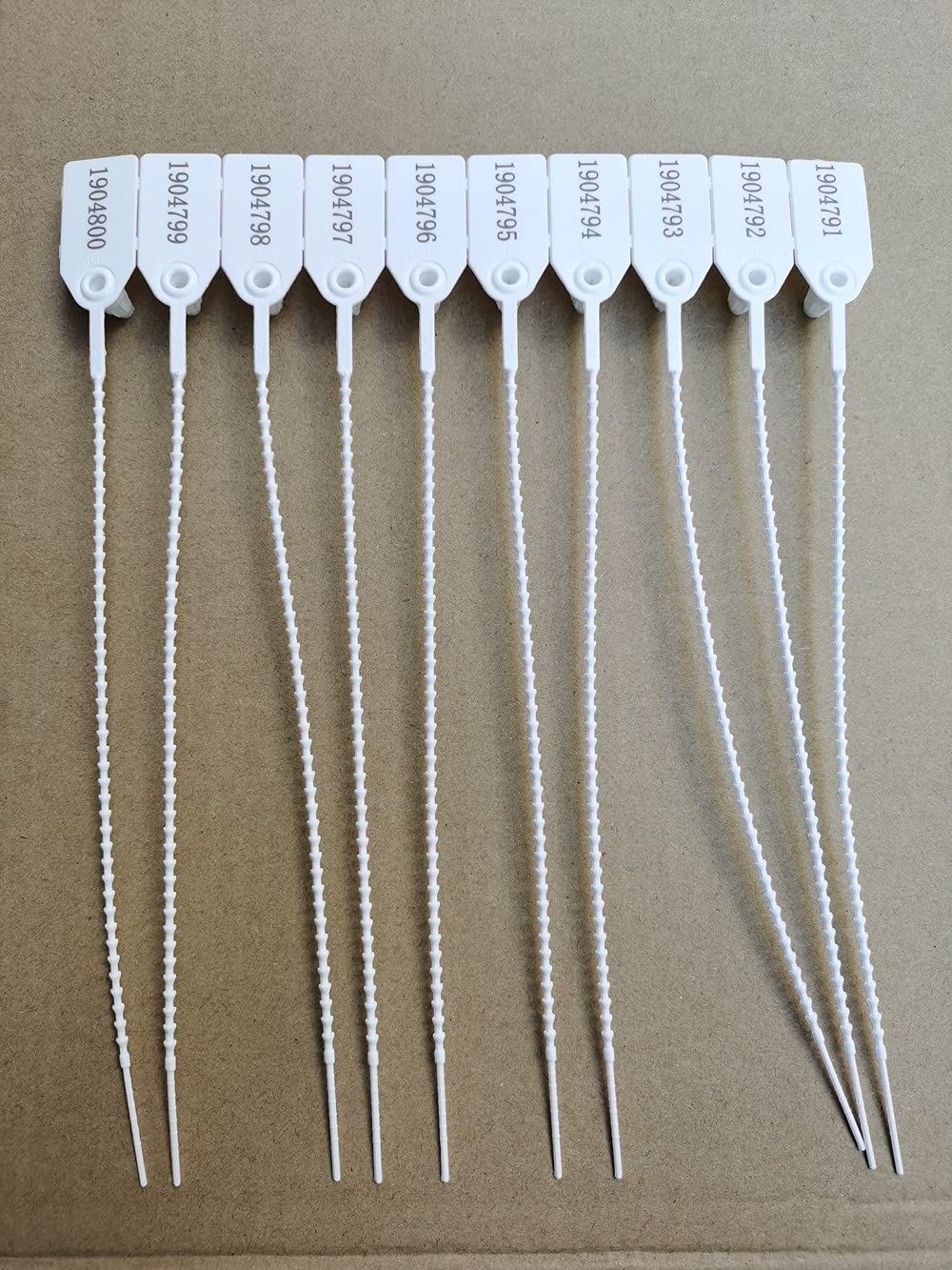 Plastikowe etykiety zabezpieczające, numerowane, odporne na manipulacje, samoblokujące się zamki błyskawiczne, długość 25 cm, białe (500 sztuk)