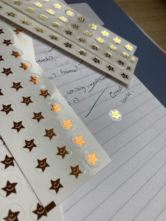 Mini reward smiley star stickers in gold, silver and bronze. 540 x 10mm stickers per pack. 180 of each colour.