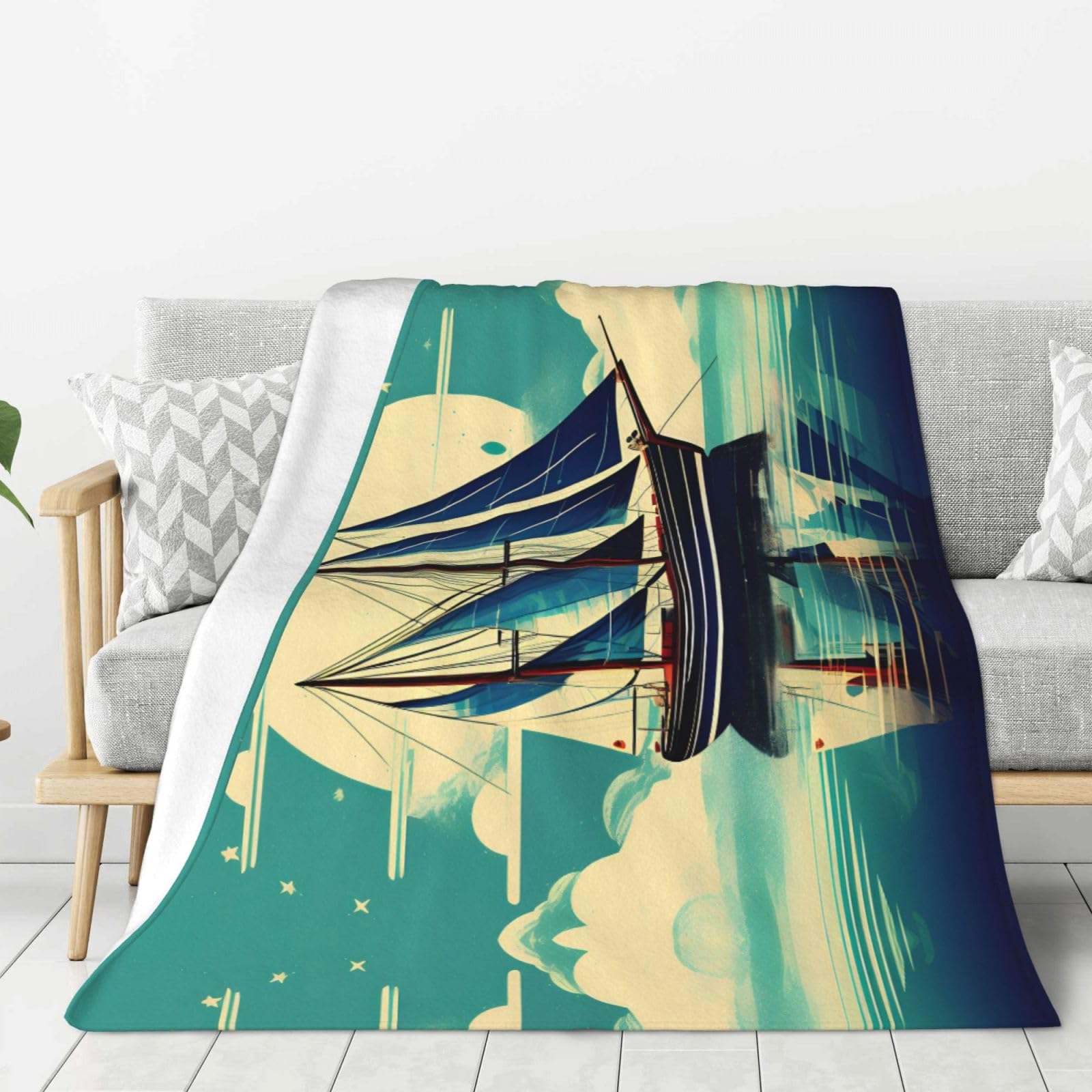 Couverture canapé motif voile pour vos soirées fraîches et le camping
