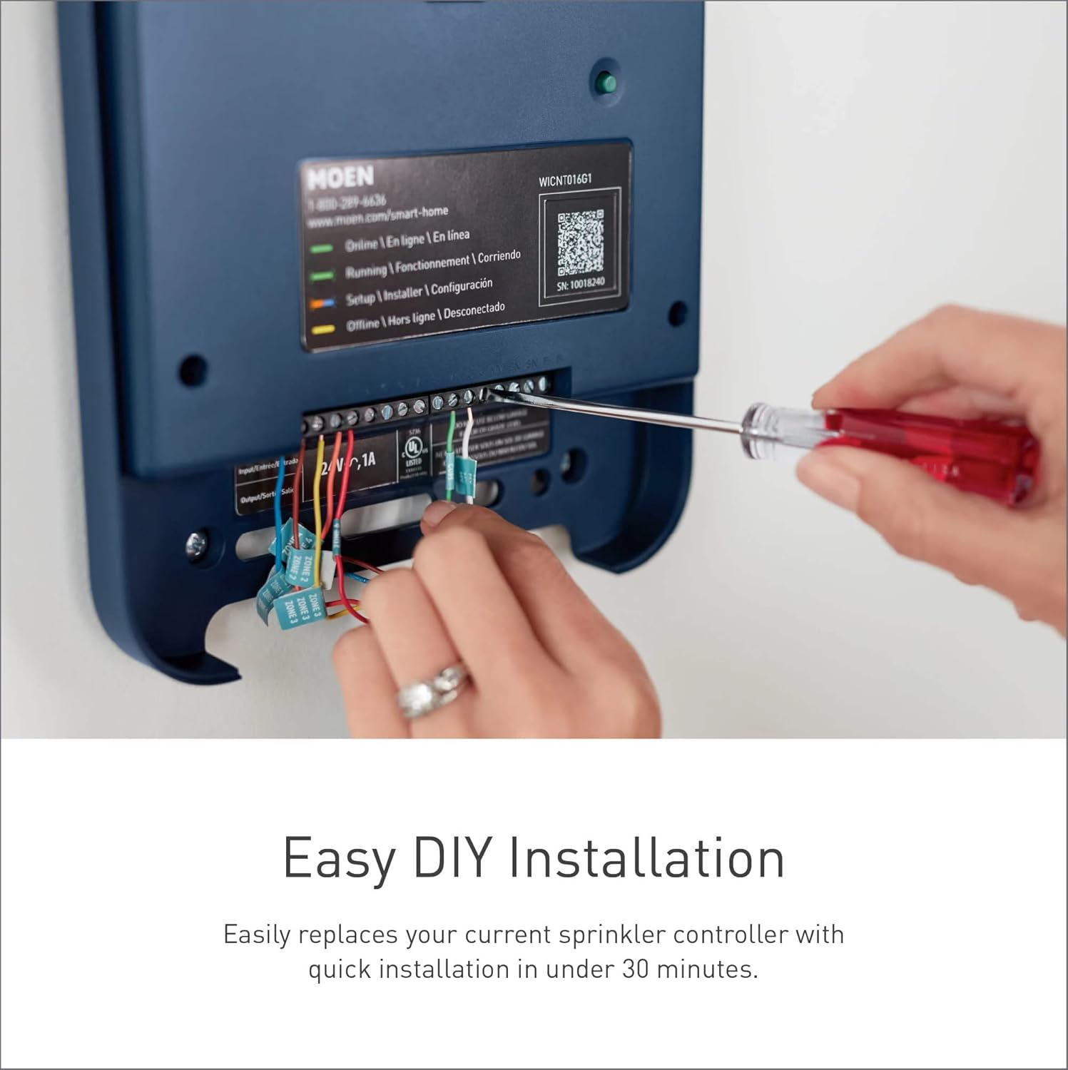 Person wiring the Moen Smart Sprinkler Controller