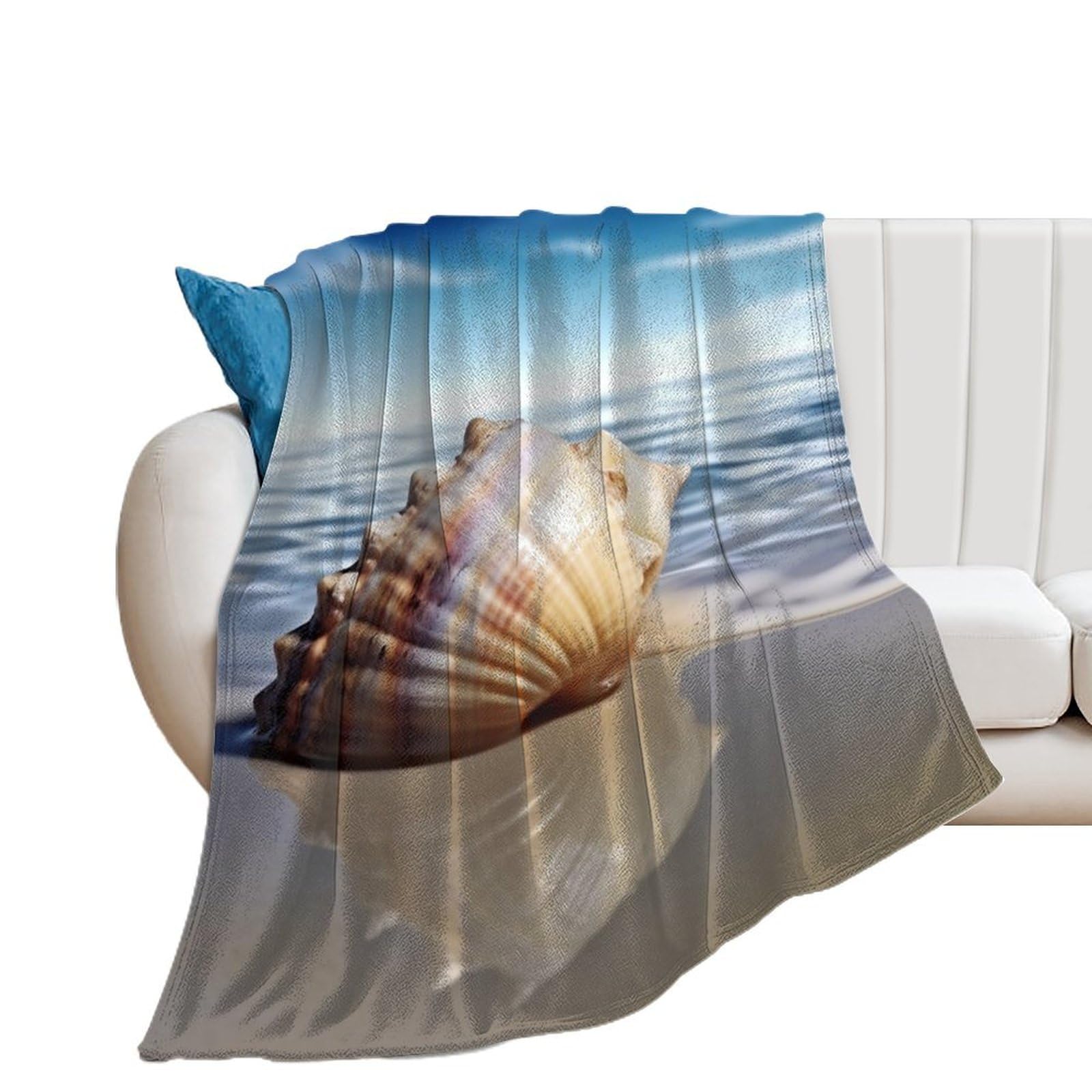 Couverture flanelle coquillages légère pour vos soirées cocooning sur le canapé ou au lit