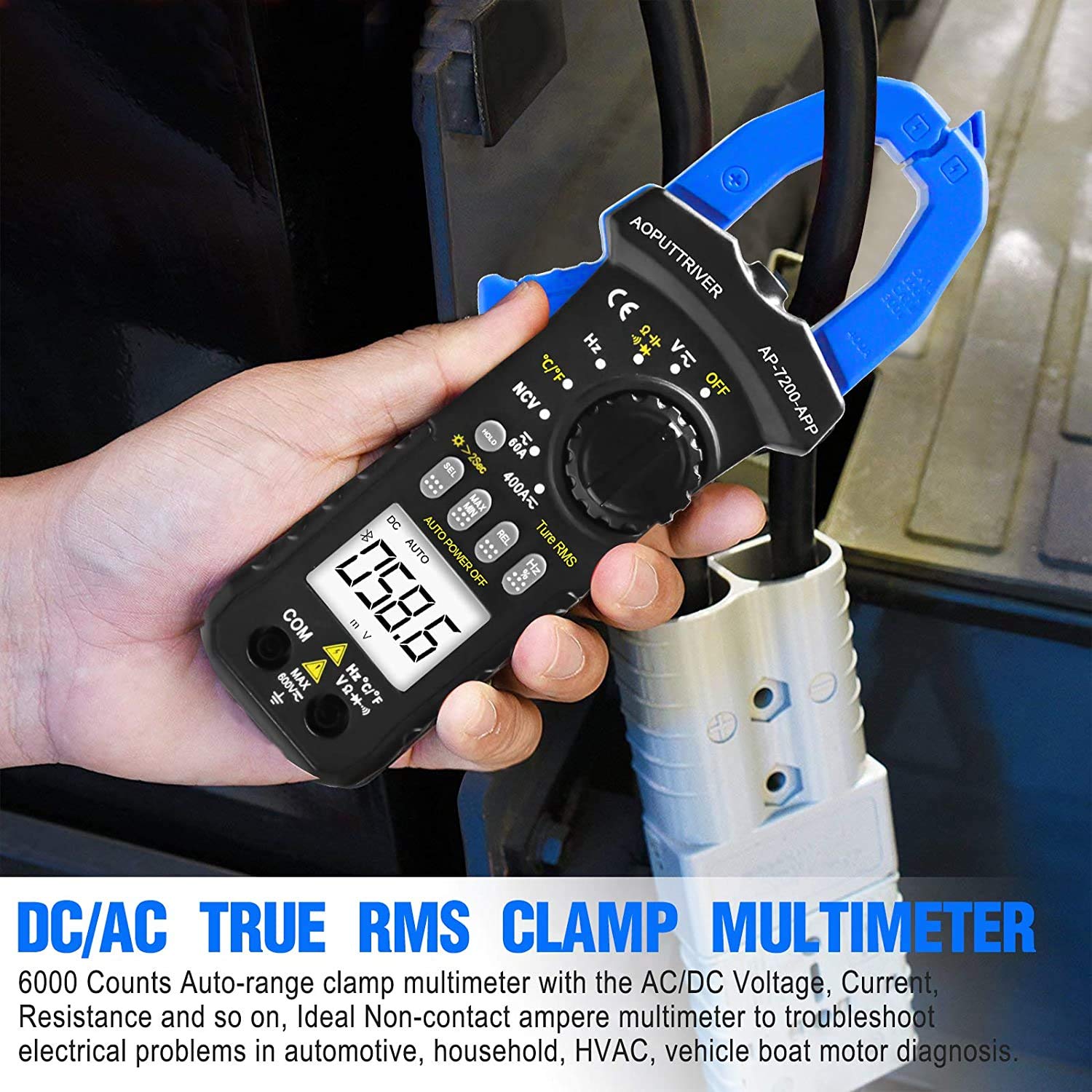 A hand holding the AOPUTTRIVER AP-7200APP Clamp Meter around an electrical cable, demonstrating AC/DC current measurement.