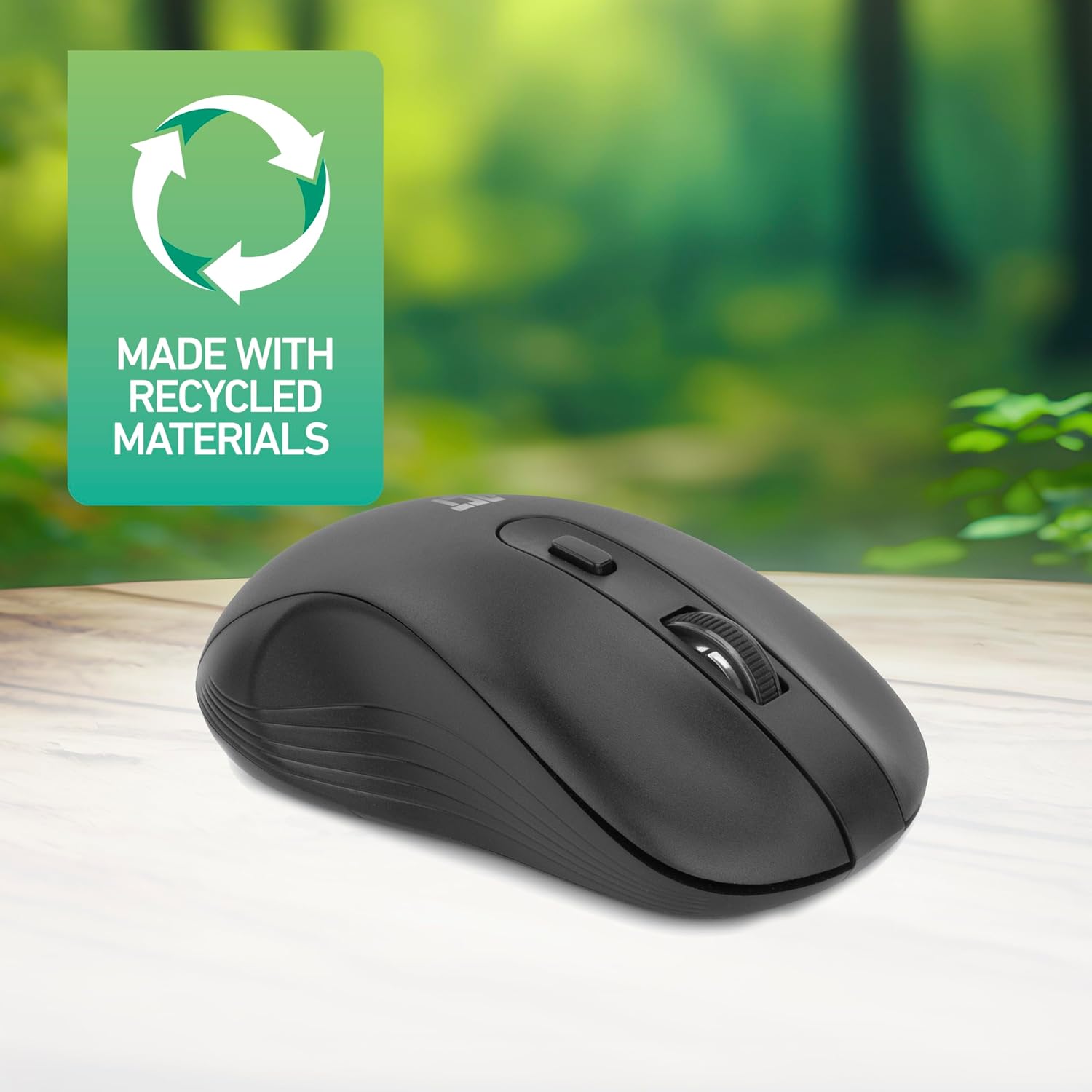 Image of the ACT AC5105 mouse on a wooden desk next to a laptop, with text indicating 'DPI switch 800/1200/1600' and 'Made with recycled materials'.