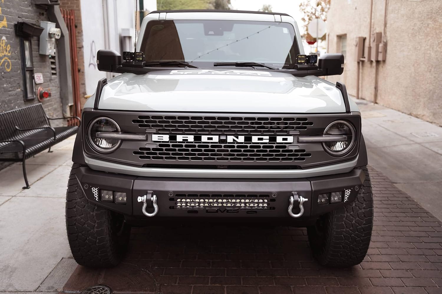 DV8 Offroad OE Plus Series Front Bumper Compatible with 2021-2026 Ford Bronco | Multiple Light Mounts | Compatible with OEM Skid Plate, 360° Camera, & Sensors | Reinforced D-Ring Mounts