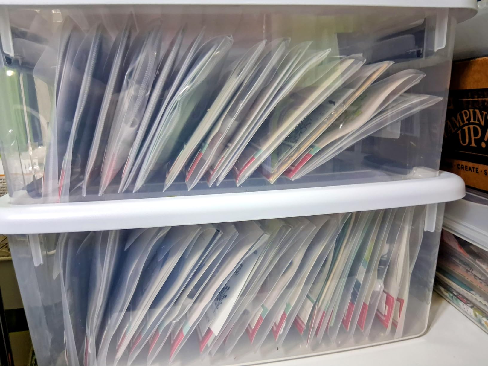 Classroom materials sorted into clear plastic storage bins