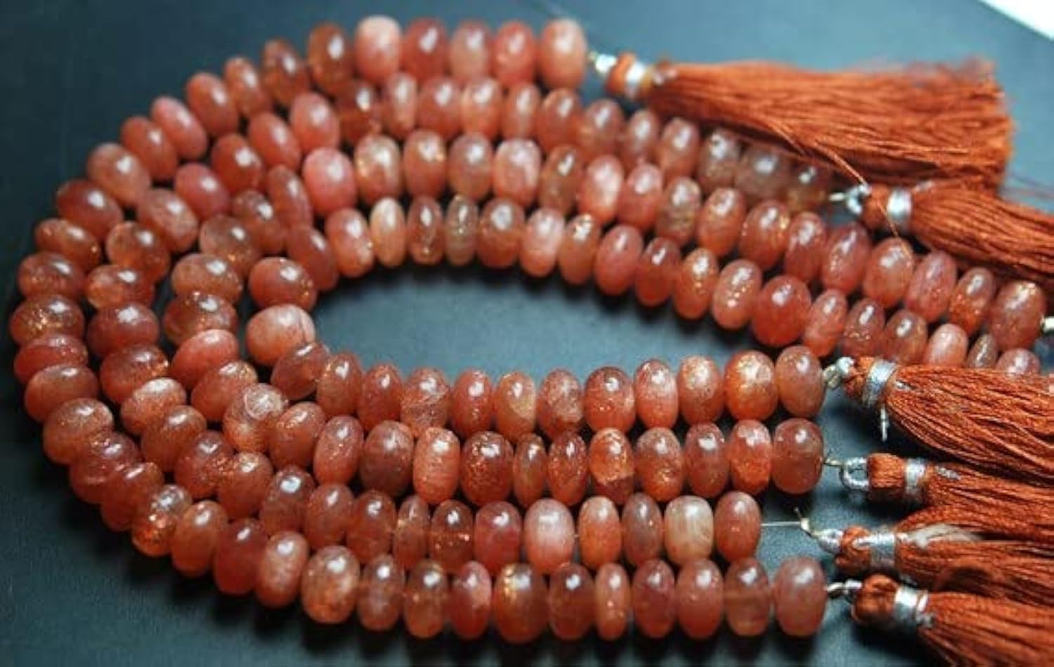 Pierre de soleil africaine : perles rondelles lisses d'exception pour haute joaillerie