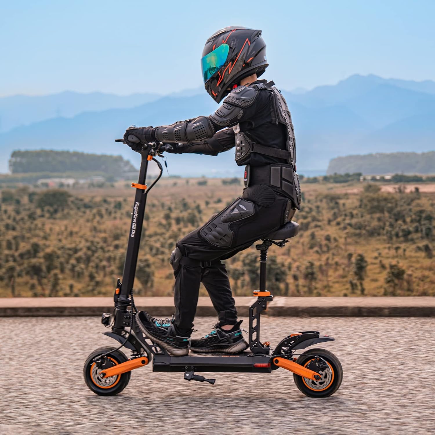 Person riding Kugookirin G3 Electric Scooter seated