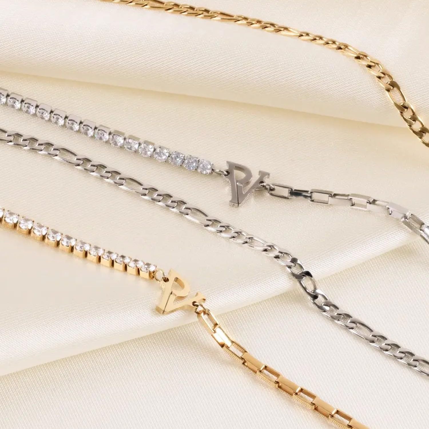 PAUL VALENTINE Tennis & Chain Anklet - Cavigliera da donna in acciaio inox, 19 cm + 5 cm di estensione, 27 zirconi bianchi, logo PV, chiusura a moschettone