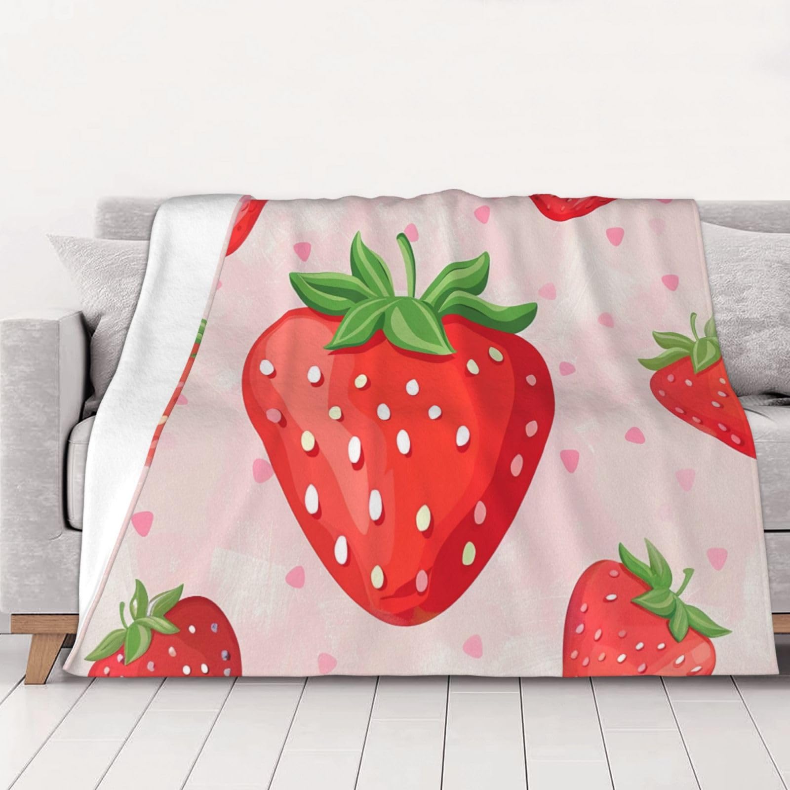 Couverture flanelle fraise contre le froid hivernal sur votre canapé