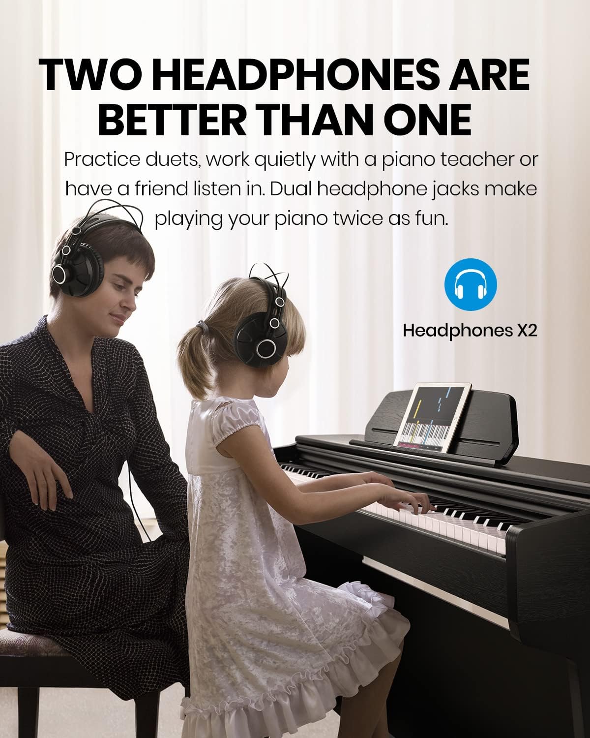 Two individuals wearing headphones while playing the Moukey MDP-450 Digital Piano