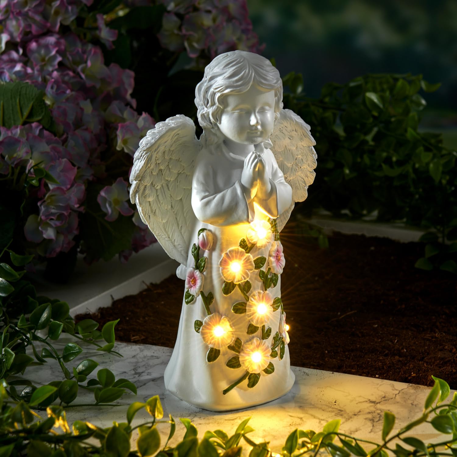 Ange gardien solaire avec fleurs pour illuminer vos allées de jardin et terrasses à la nuit tombée