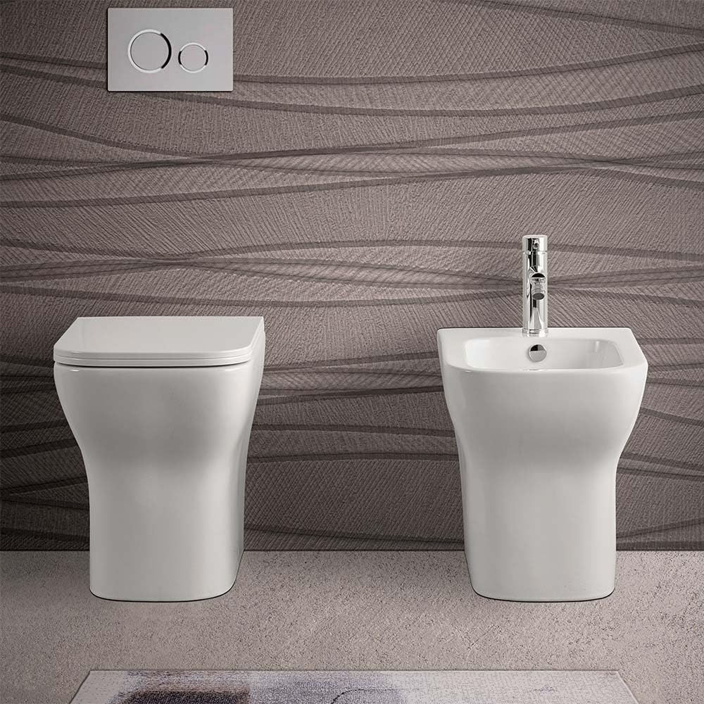 Wc singolo filomuro senza brida bianco lucido, scarico multiplo a parete o a pavimento, fissaggi inclusi, PLANA