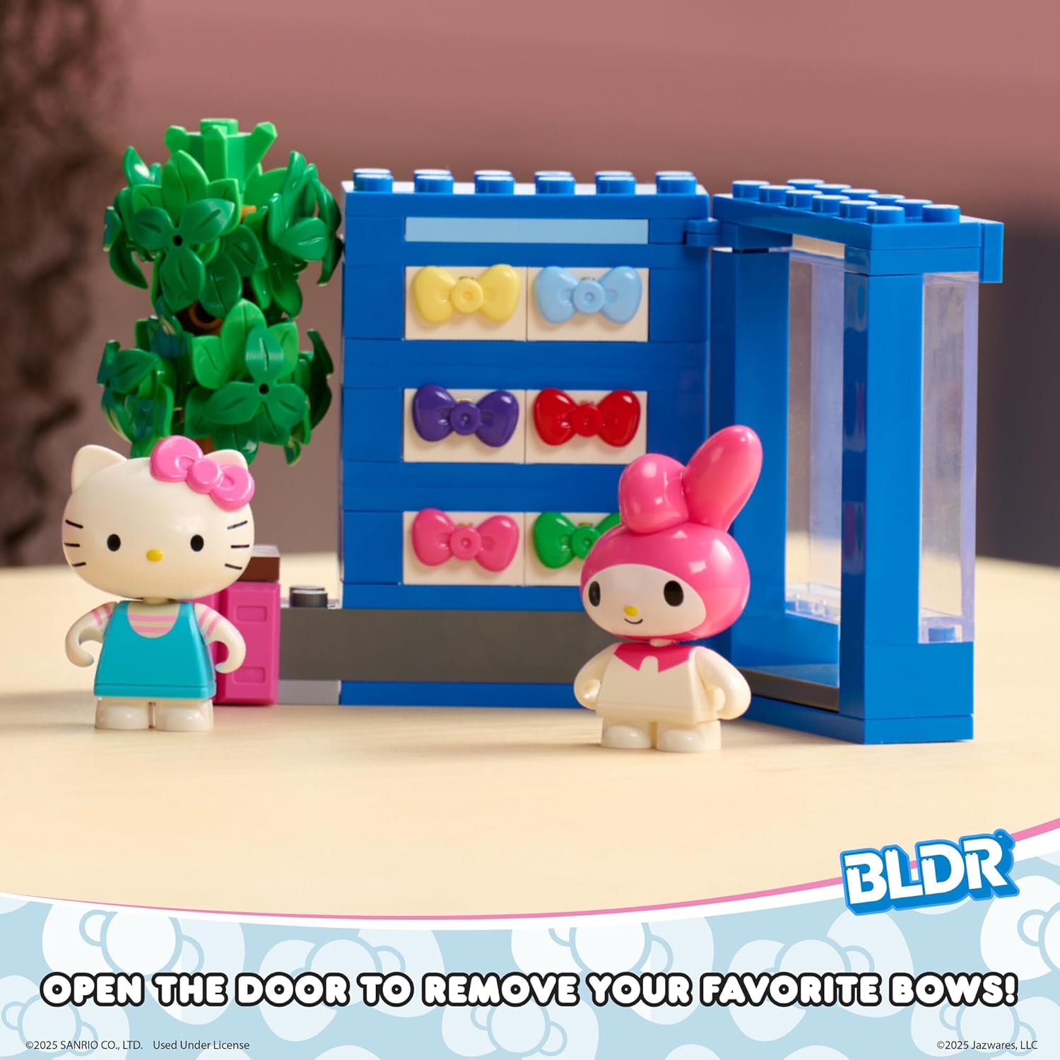 Side view of the assembled BLDR Hello Kitty and Friends Bow Vending Machine Building Set, showing the tree, vending machine, and minifigures.