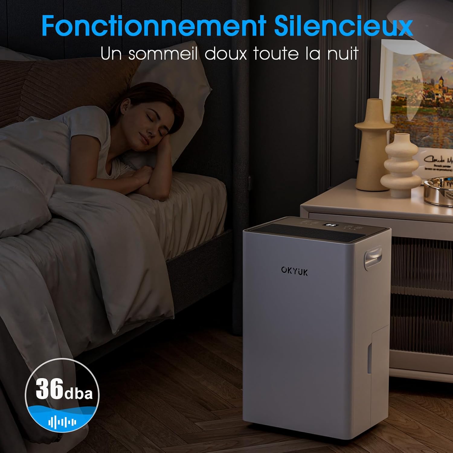 OKYUK dehumidifier operating quietly in a bedroom at night, with a '36dBA' indicator, suggesting silent operation.