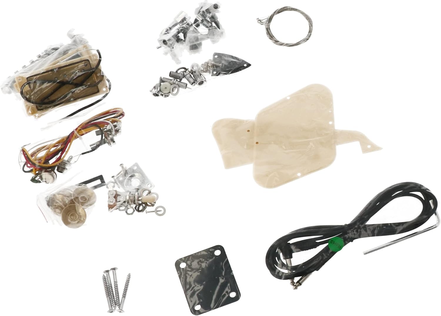 Assortment of guitar hardware and electronic components including pickups, tuners, bridge, and wiring.