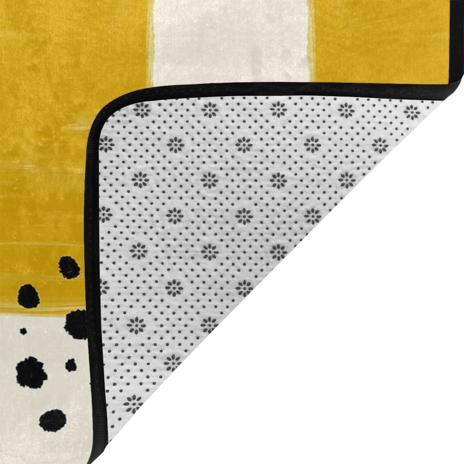Tapis imprimé jaune moutarde et noir, absorbant l'eau et durable, adapté à tout espace de vie