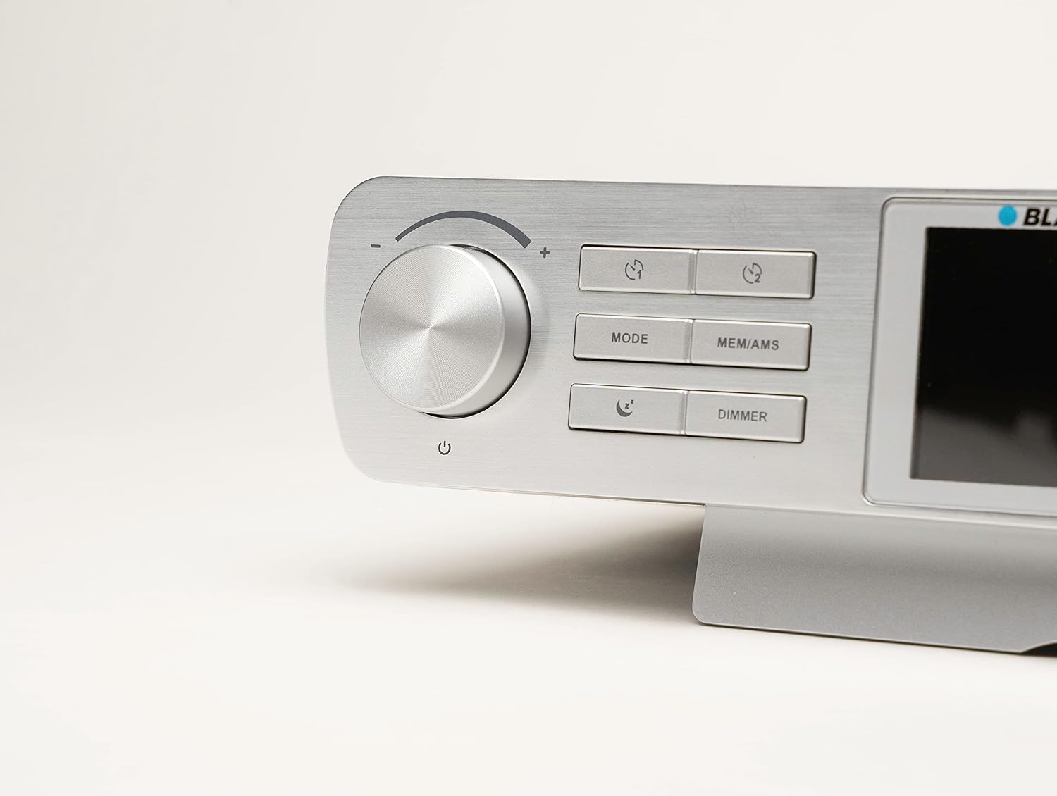Close-up of the control panel on the Blaupunkt KRD 100, showing the volume knob, power button, and function buttons.