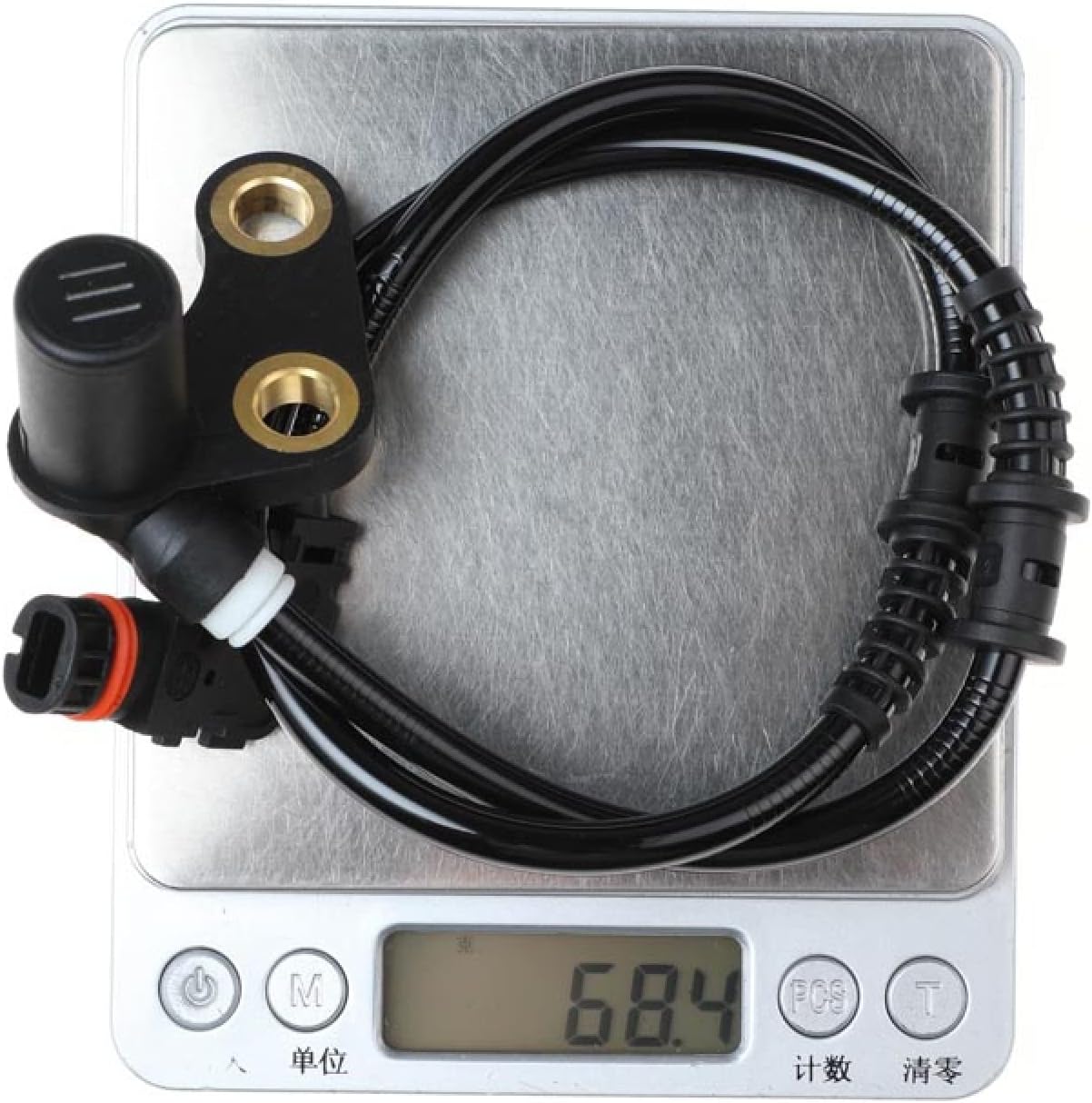 LadyCent ABS Wheel Speed Sensor on a digital scale, showing a weight of 68.4 grams.
